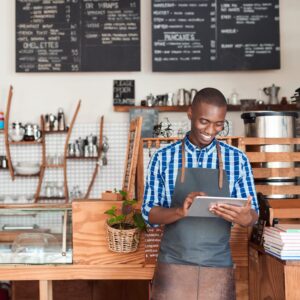 person smiling at tablet