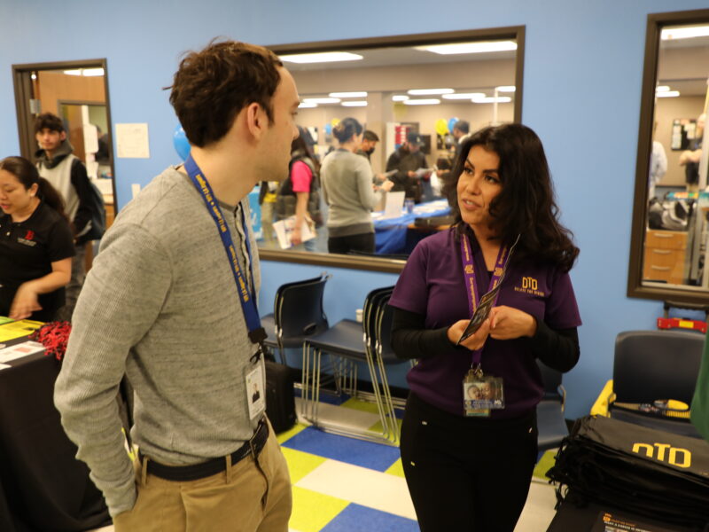 DTD staff talking to teacher