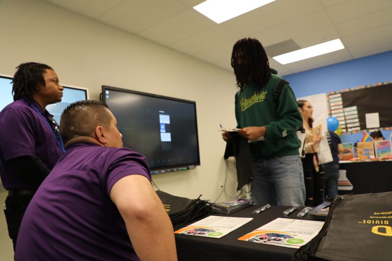 Interns talking with a youth