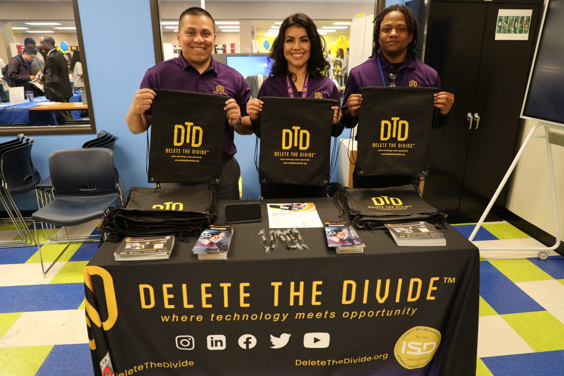 Interns holding up DTD bags