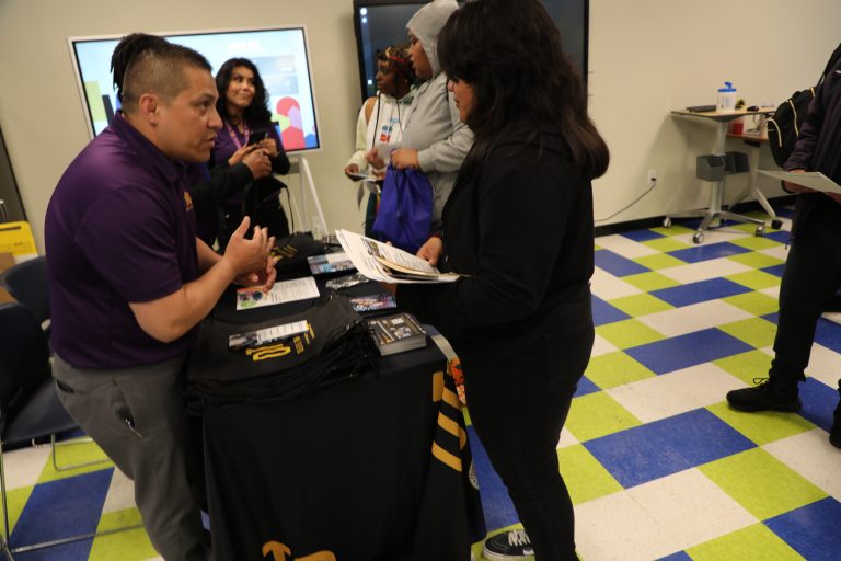 intern talking with youth