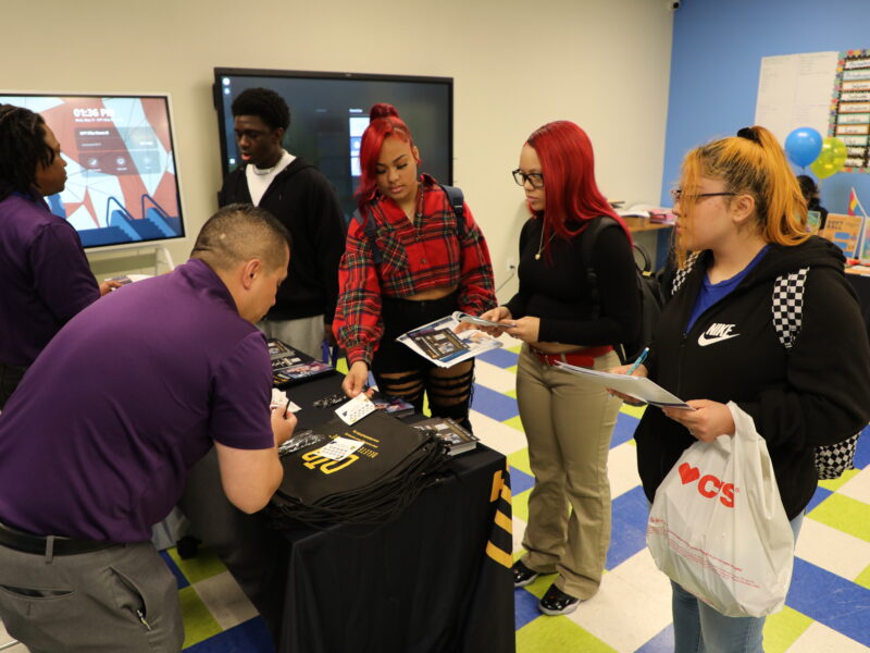 DTD staff helping a group of students