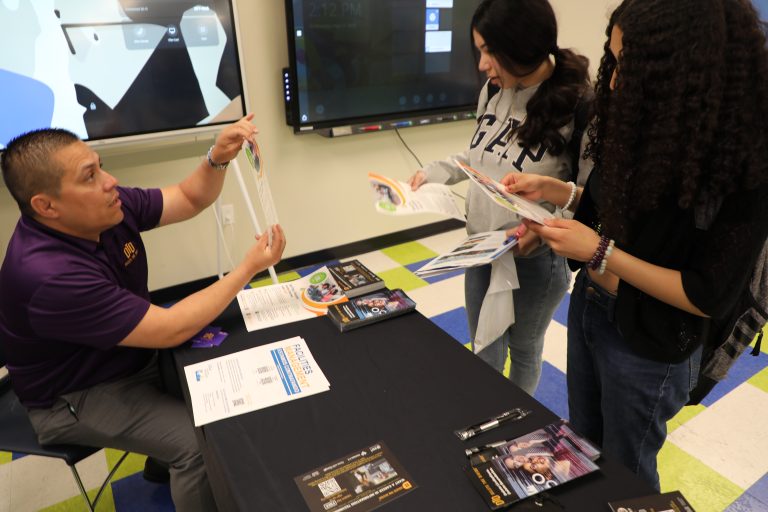 Intern giving out information