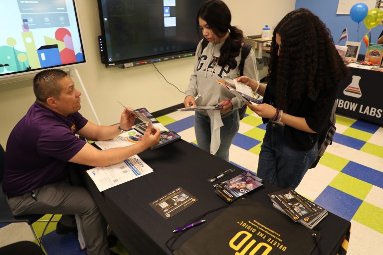 Intern giving out information