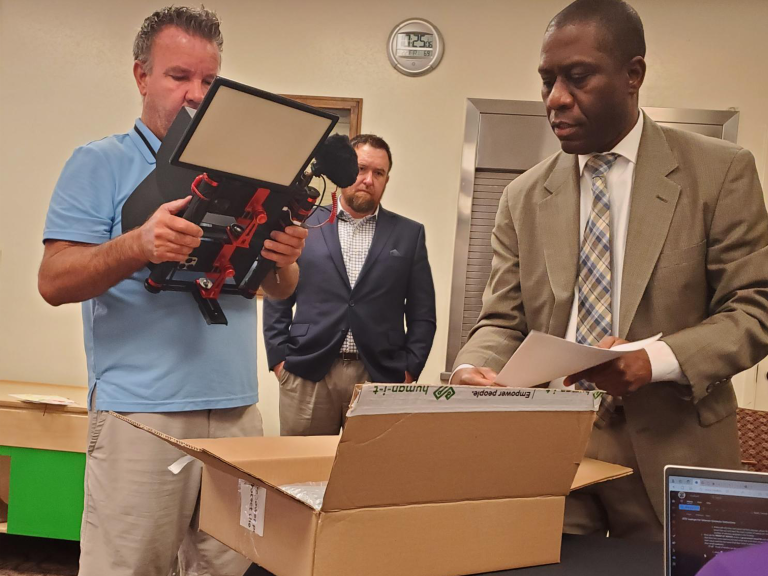 Professionals holding a Laptop