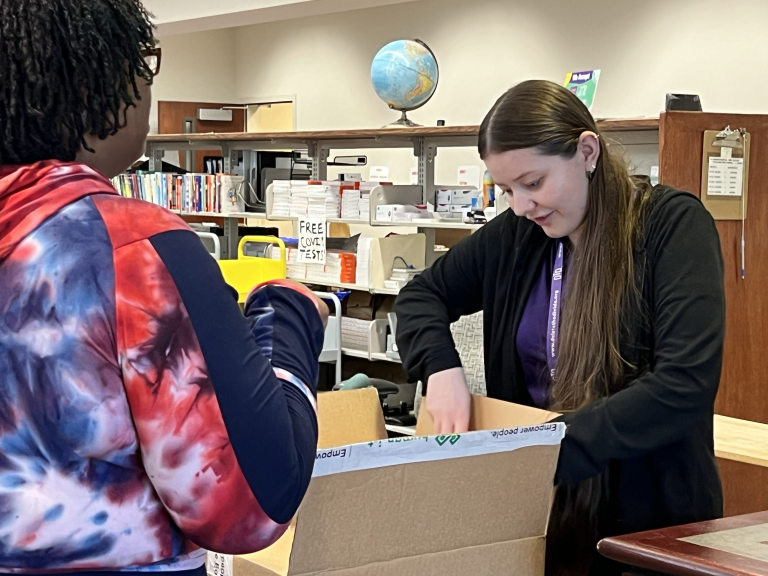 intern getting laptop from box