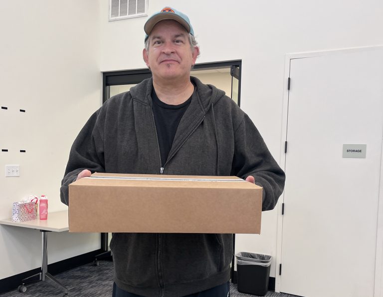 veteran holding laptops