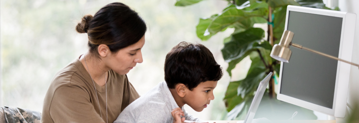laptops for veterans banner with veteran using a laptop with child