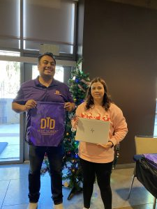 Woman in pink jacket posing with DTD intern