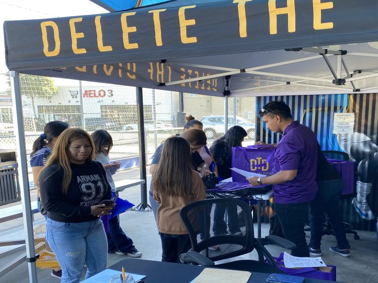 DTD interns giving away laptops.