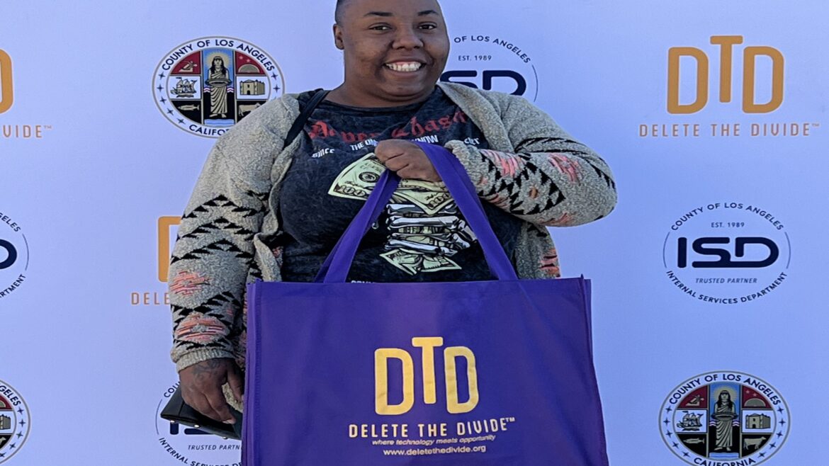 a female holding a purple bag and posing for photo