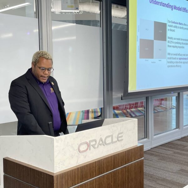 Delete The Divide intern giving a presentation on Understanding Model Efficiency