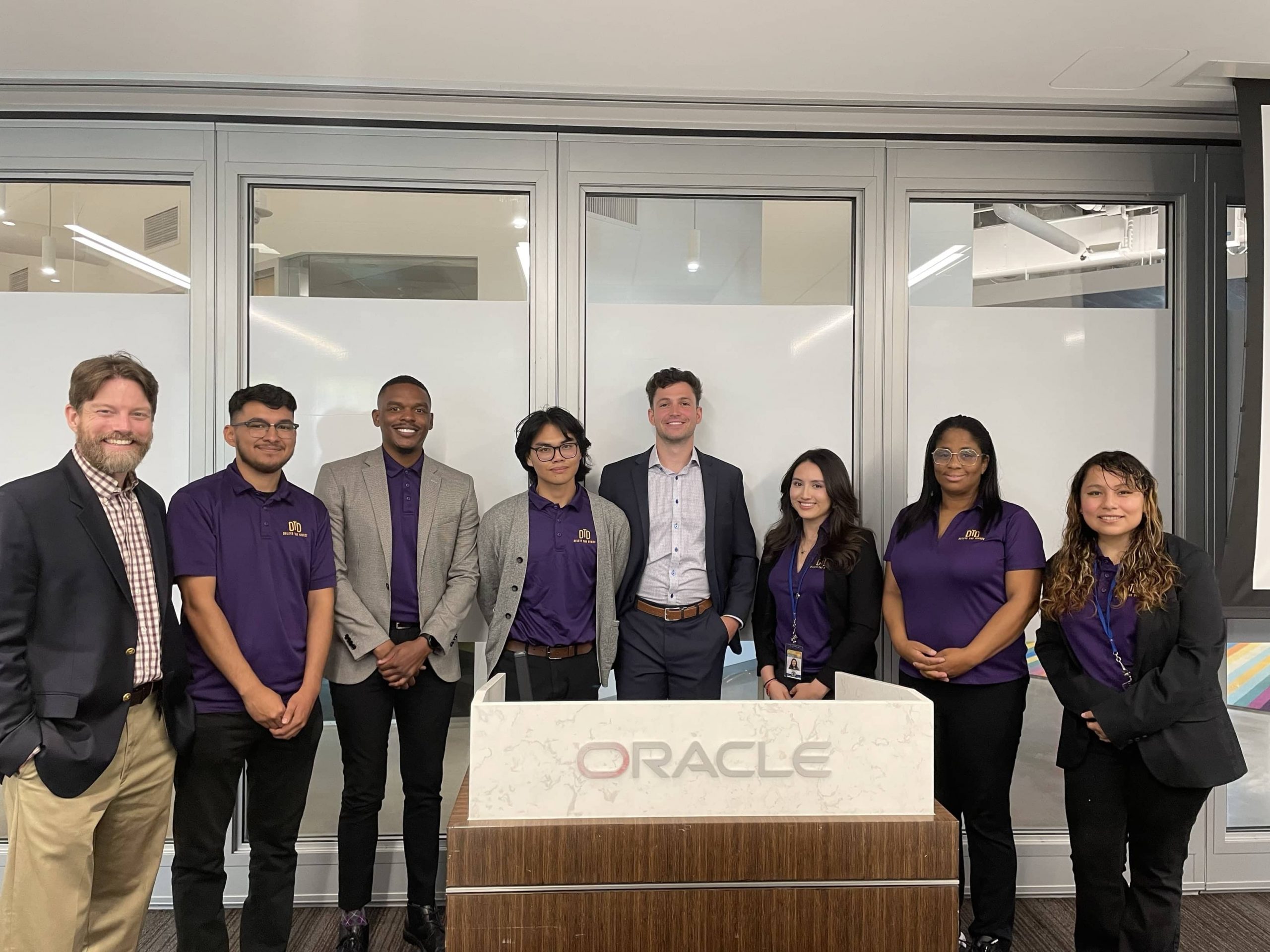 Delete The Divide group photo with Oracle staff