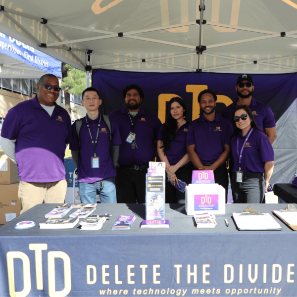 interns standing in front of DTD booth