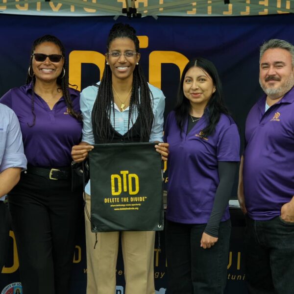 a group of DTD interns standing with a student