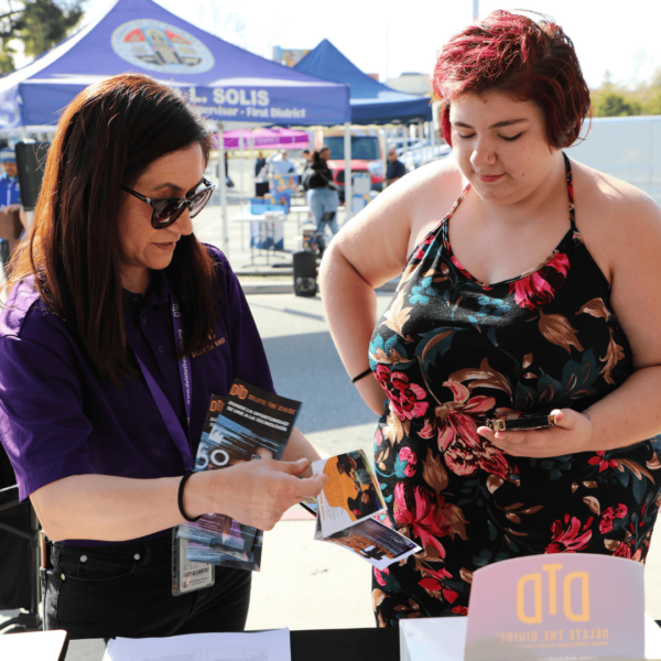 intern showing flyer to someone
