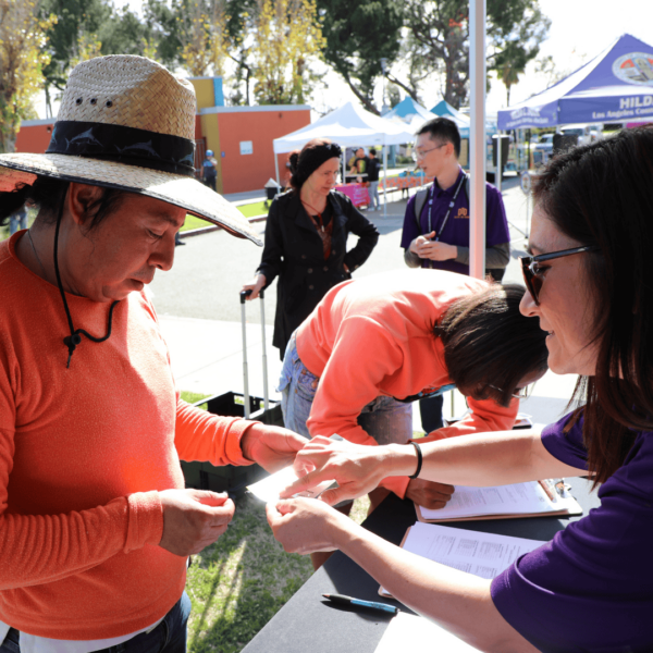 interns talking to and helping others