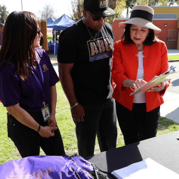 intern and representative helping someone