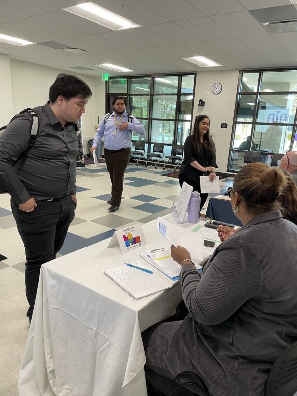 an intern talking to two recruiters