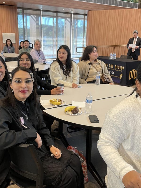 DTD interns smiling while sitting around a table