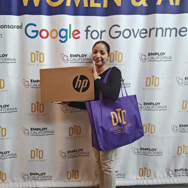 woman holding laptop