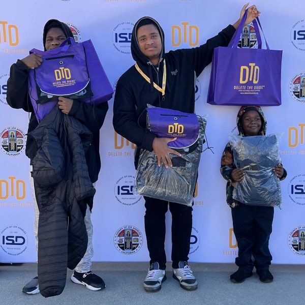 three children holding DTD bags