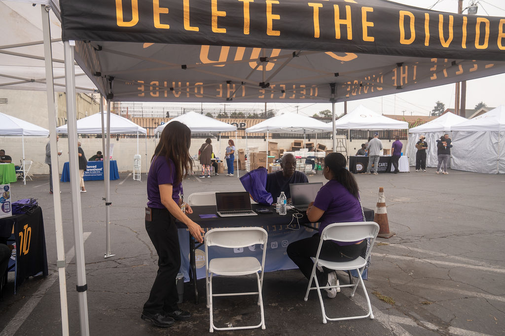 DTD staff on the computer trying to help someone