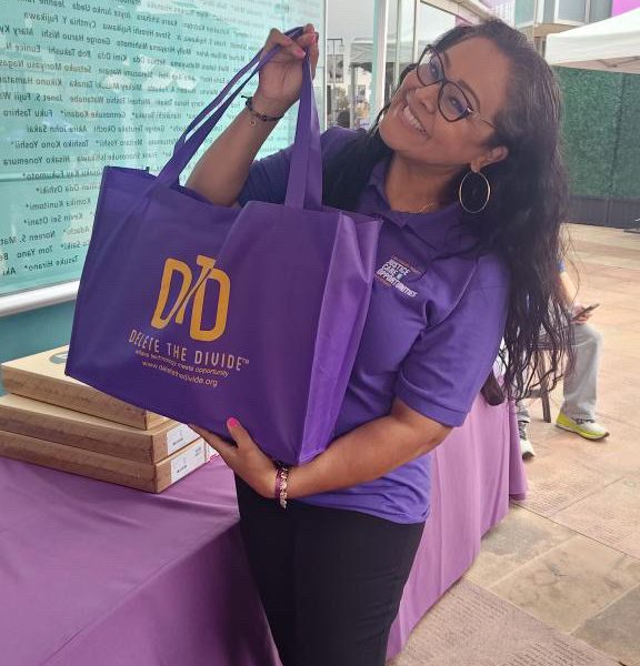 a person holding a DTD bag with laptop in it