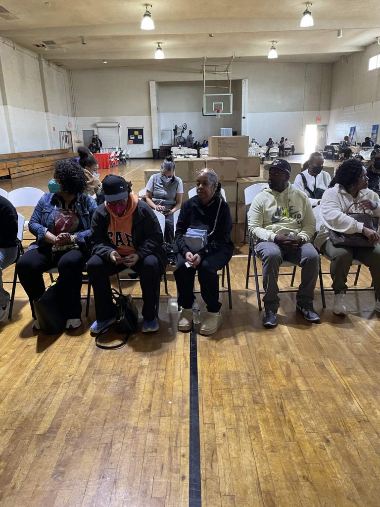 residents waiting for laptop pickup and fire relief supplies